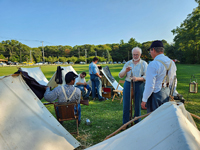 cleaning their muskets